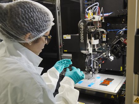 Emily Bezerra in protective clothing in a lab