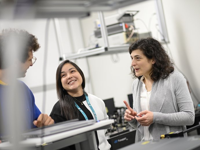 researchers in conversation in a lab