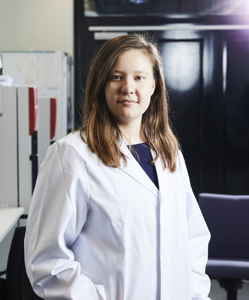 Portrait of Tutku Bedük in a lab wearing a white lab coat