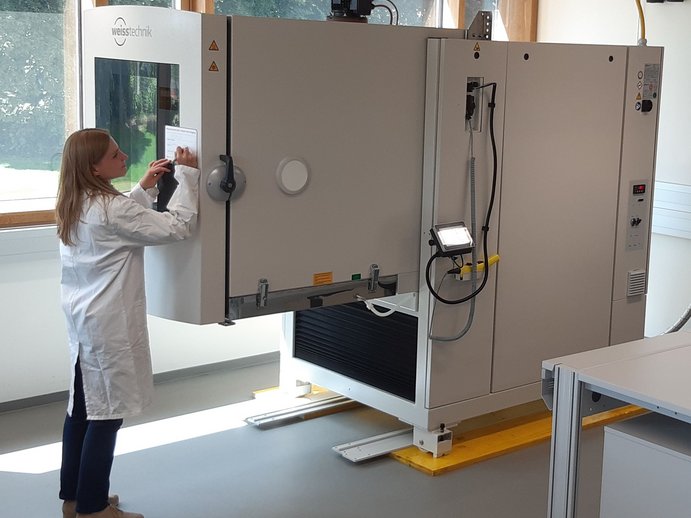 researcher in front of the climate chamber