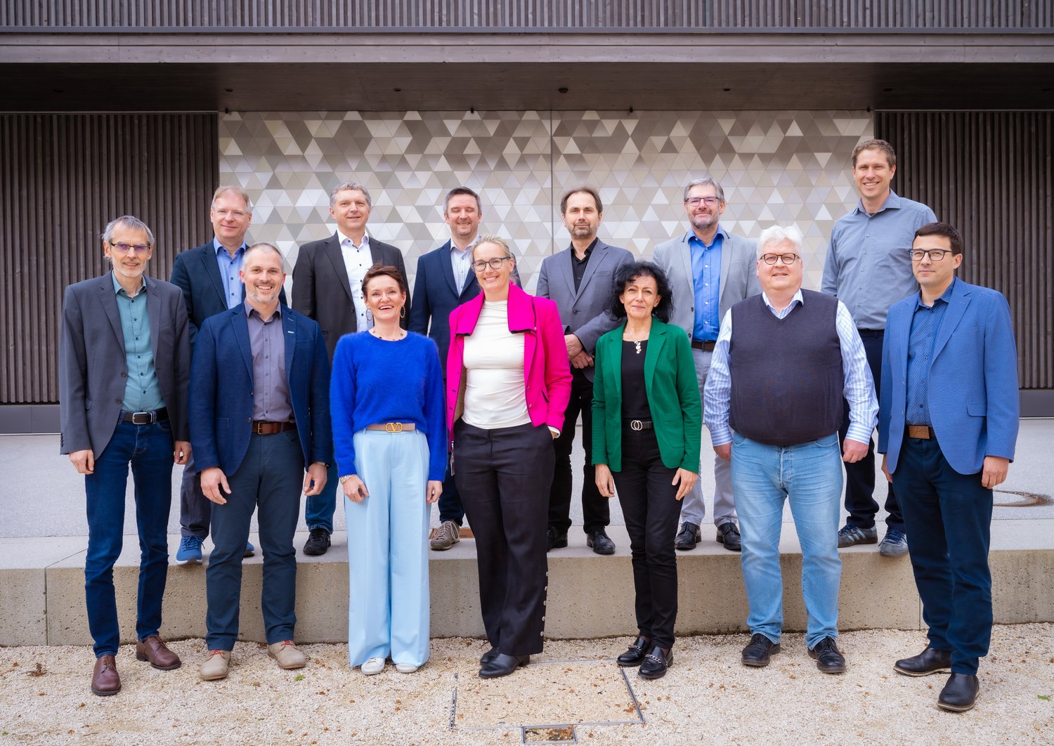 group picture, people standing in front of a building