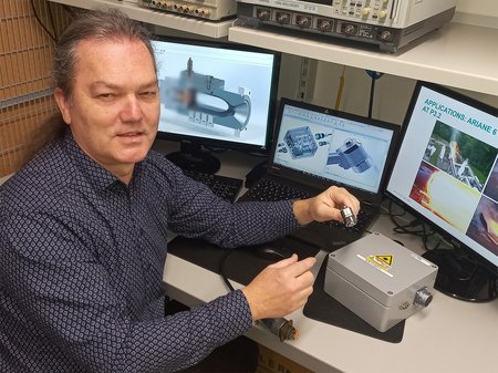 Gerhard Kroupa with the ignition laser in the lab